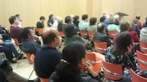 Público asistente a una charla de ADICAE