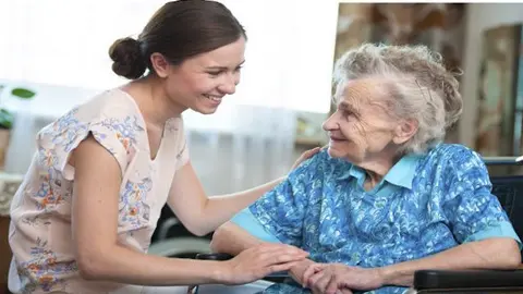 senior woman with home caregiver
